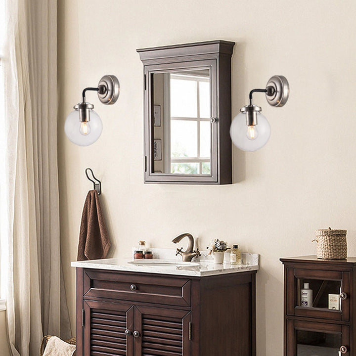 Polished Nickel and Black Frame Wall Sconce with Clear Glass Globe Shade by Bethel