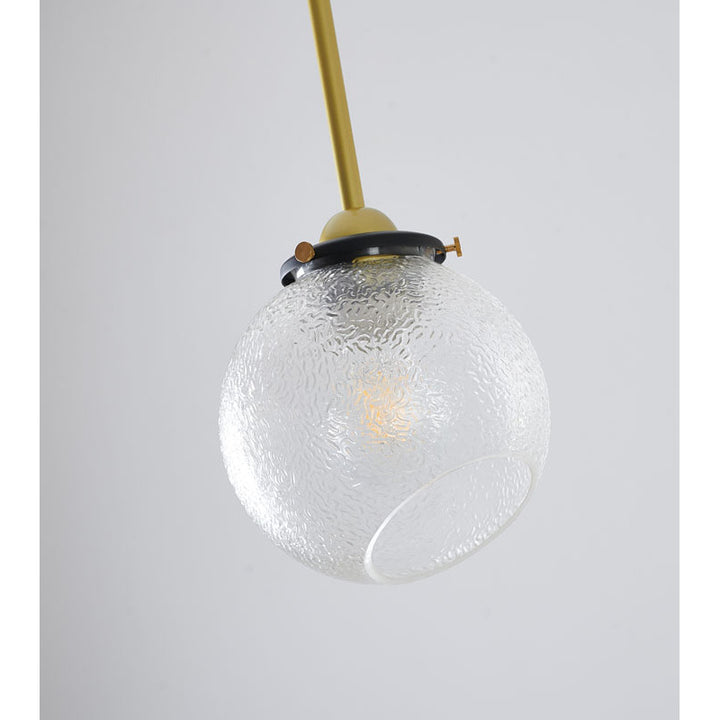 Black and Gold Hardware Single Pendant Light with Clear Patterned Glass Shade by Bethel - view 3